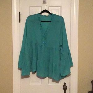 100% polyester top with wide sleeves